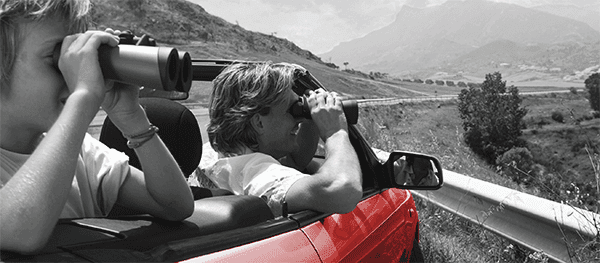 Looking Out of A Car With Binoculars